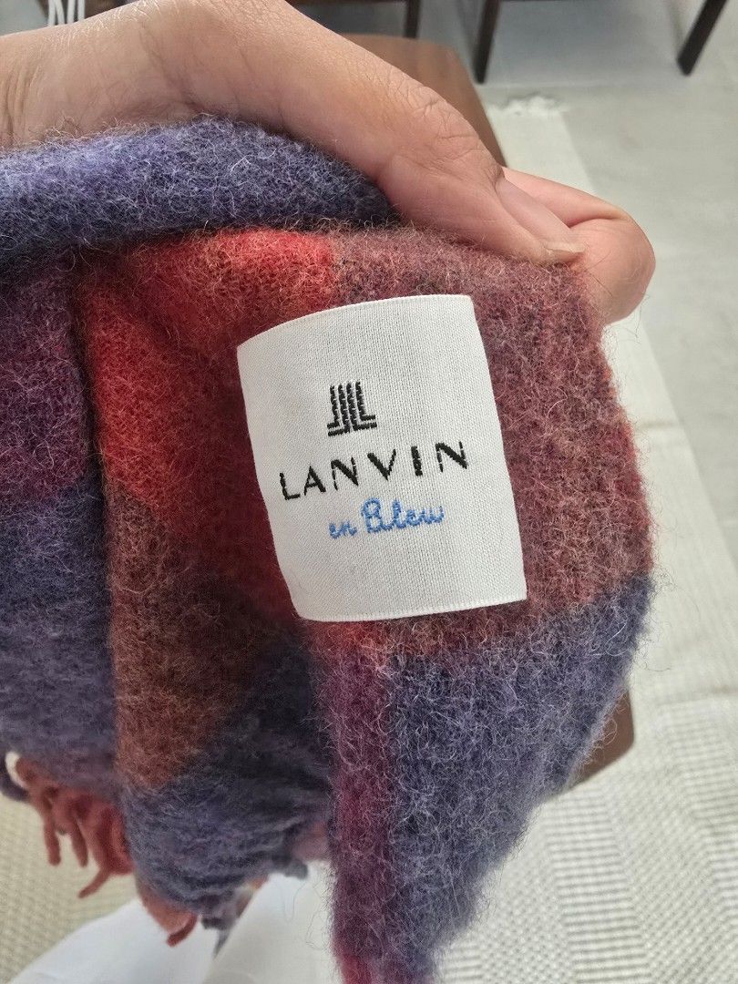 LANVIN en Bleu Cashmere Check Scarf (Category: Scarves) located in Davao. Submitted by moodsale (Listing ID 1467225265, Image 2). Description: LANVIN en Bleu wool and cashmere check scarf in wine colorway. Large plaid pattern mixing red, purple, orange, and blue tones. Fringe trim on both ends. Fabric tag reads 100% cashmere. Original retail price around ¥13,200. Cozy winter accessory..