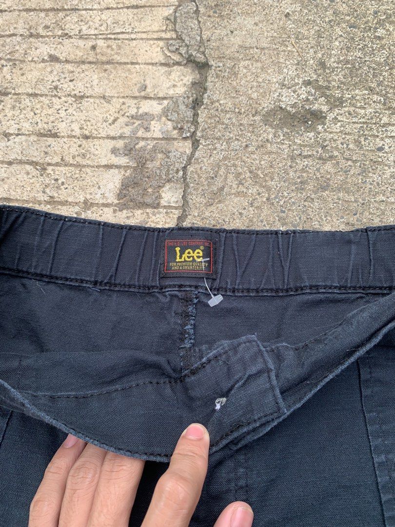 Lee Black Denim Utility Shorts (Category: Shorts) located in Manila. Submitted by findusthrift (Listing ID 1467176408, Image 3). Description: - Brand: Lee - Color: Black - Style: Utility shorts for casual wear - Waistband: Elastic at the back for added comfort - Pockets: Front patch pockets and two back pockets (one with Lee logo patch) - Closure: Button fly.