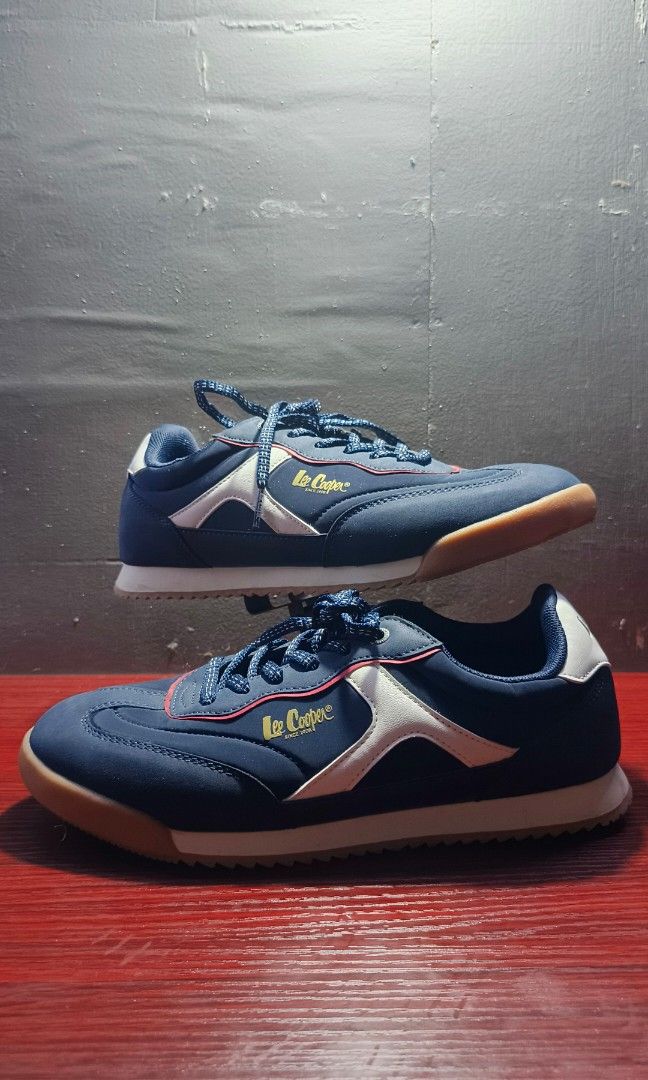Lee coopers (Category: Sneakers) located in Manila. Submitted by reytambuco24 (Listing ID 1467312485, Image 2). Description: Color: Navy Blue / White / Red Brand: Lee Cooper Style: Casual Retro Sneakers Closure: Lace-Up Sole: White Midsole with Gum Outsole.
