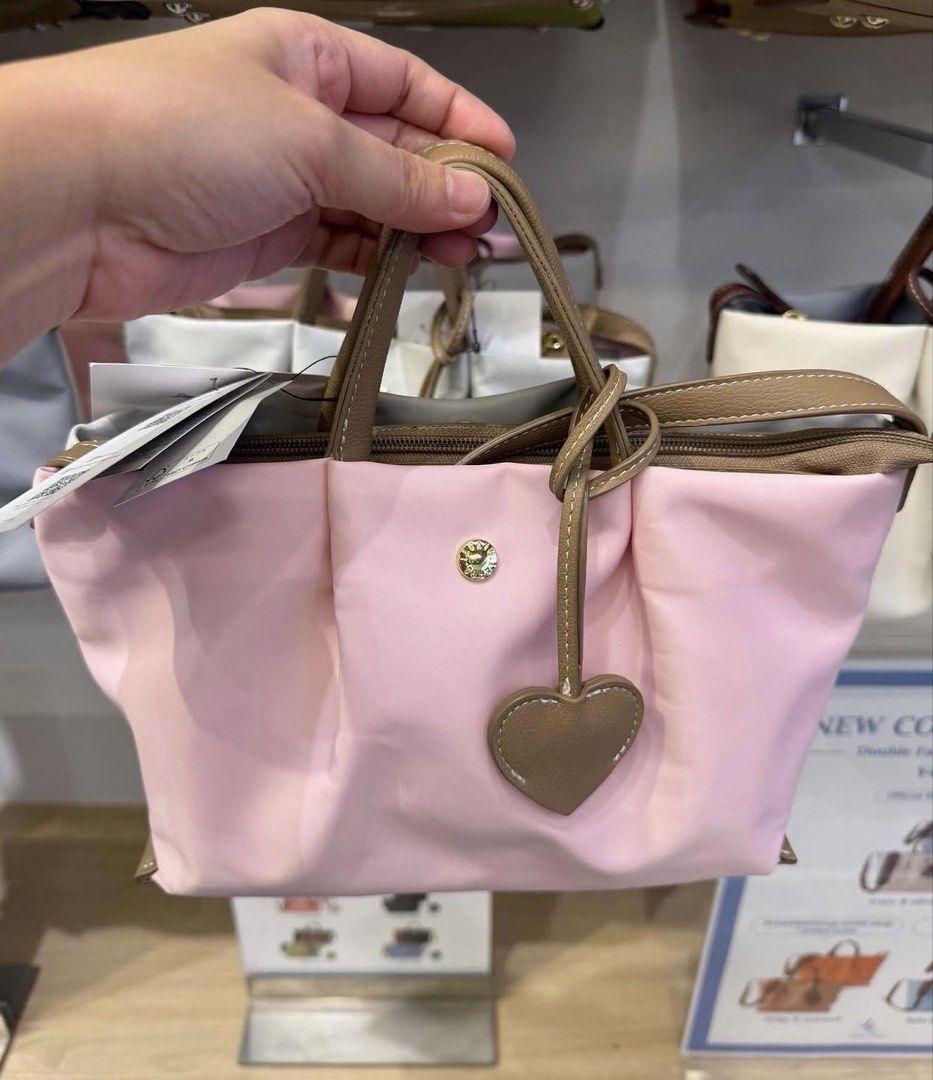Legato largo sakura double face (Category: Sling Bags) located in Quezon City. Submitted by jptrc (Listing ID 1467349377, Image 1). Description: Legato largo limited edition sakura Mini shoulder bag color pink & gray Comes with heart charm and tag Brand new from japan Never been used .