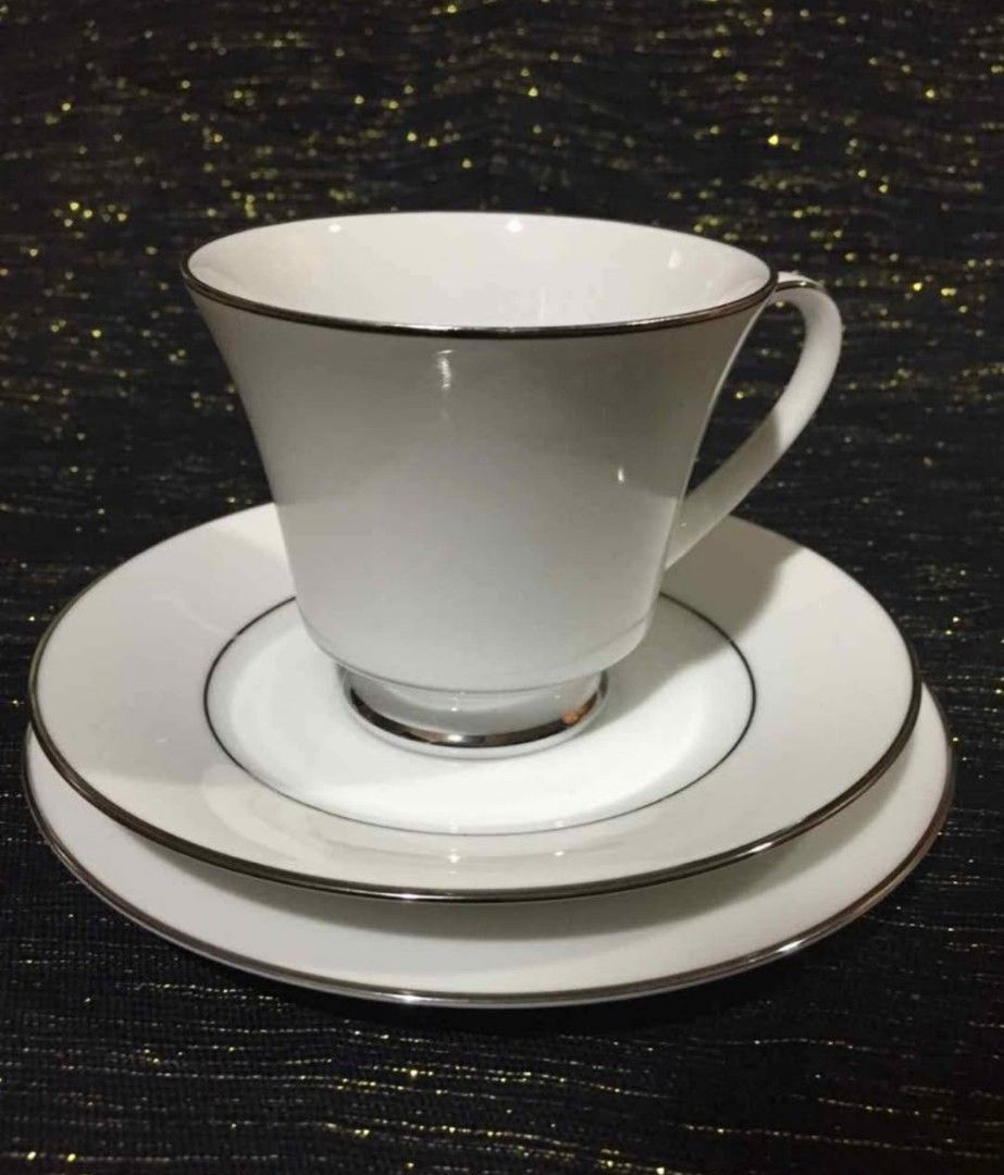 Legendary by Noritake Regency Silver 18-Piece Tea Set (Category: Coffee & Tea Tableware) located in Cainta. Submitted by veronica2277 (Listing ID 1467269587, Image 2). Description: Complete vintage 18-piece tea set from the Debenhams Collection. Includes six tea cups, six tea saucers, and six tea plates. Fine china crafted in Sri Lanka. White design with delicate silver trim. Original box included. Great for hosting guests or daily afternoon tea.