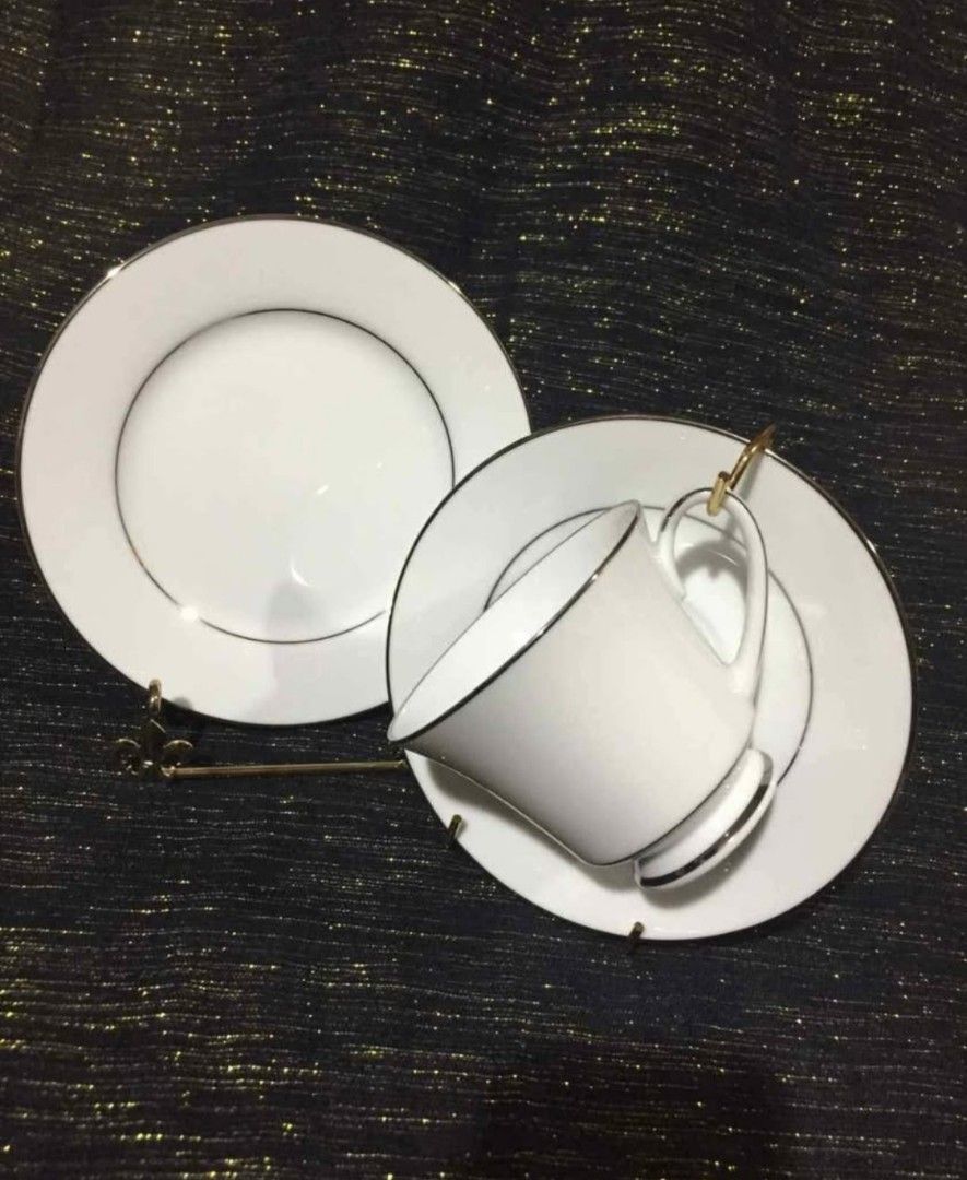 Legendary by Noritake Regency Silver 18-Piece Tea Set (Category: Coffee & Tea Tableware) located in Cainta. Submitted by veronica2277 (Listing ID 1467269587, Image 1). Description: Complete vintage 18-piece tea set from the Debenhams Collection. Includes six tea cups, six tea saucers, and six tea plates. Fine china crafted in Sri Lanka. White design with delicate silver trim. Original box included. Great for hosting guests or daily afternoon tea.