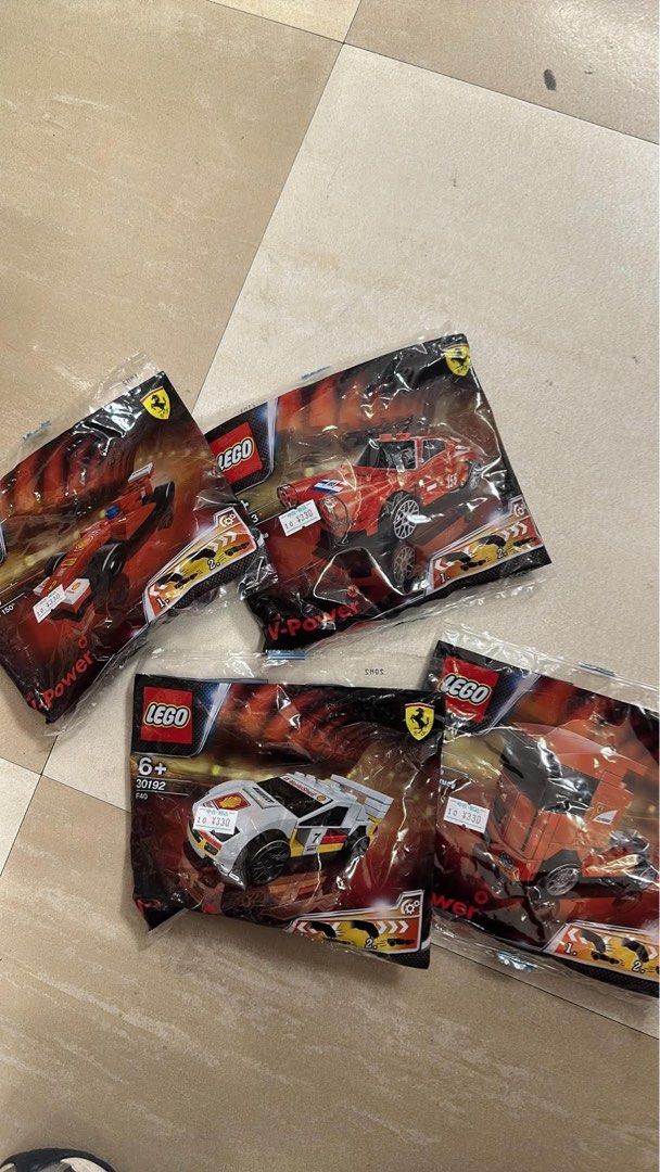 LEGO Shell V-Power Ferrari Polybag Collection 4 Sets (Category: Lego & Building Sets) located in Andop. Submitted by jimson.forest (Listing ID 1467290119, Image 1). Description: - Set of 4 unopened LEGO Shell V-Power Ferrari polybags - Includes white 30192 F40 set and 3 red/orange vehicle sets - All items sealed in original plastic packaging - Original price stickers still attached - Ideal bundle for LEGO and Ferrari collectors.