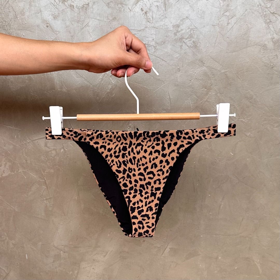 Leopard Print Bikini Bottom Size XS (Category: Bikinis & Swimsuits) located in Balanga. Submitted by manitidiana (Listing ID 1467317548, Image 1). Description: - Trendy leopard print bikini bottom - Classic cut for a flattering fit - Fully lined with soft black fabric inside - Bold animal print pattern all over - Ideal for beach trips, resort vacations, and pool days.