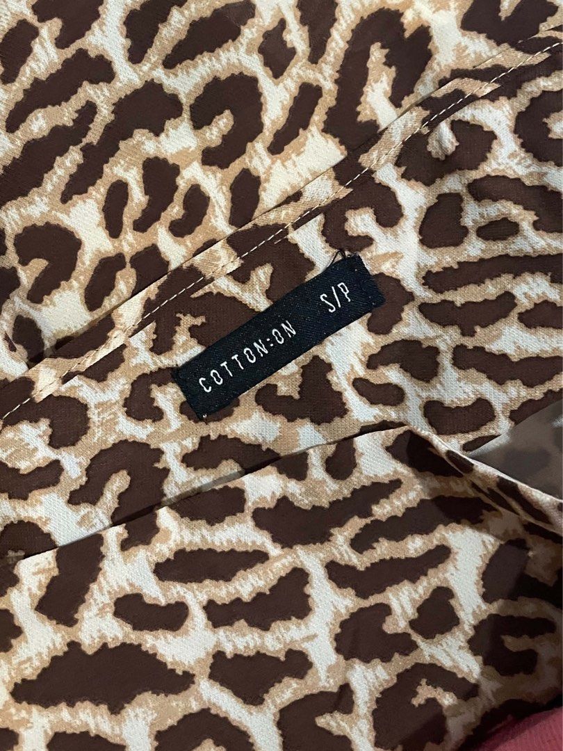 Leopard Print Cami Top (Category: Sleeveless) located in Manila. Submitted by joclutter (Listing ID 1467318708, Image 3). Description: - Brown and cream leopard print design - Thin spaghetti straps with a chic square neckline - Flowy, lightweight, and comfortable material - Versatile basic for layering or standalone wear - Pairs easily with denim jeans or shorts.