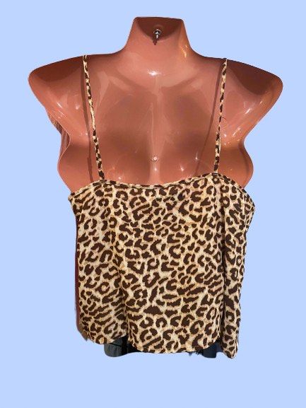 Leopard Print Cami Top (Category: Sleeveless) located in Manila. Submitted by joclutter (Listing ID 1467318708, Image 2). Description: - Brown and cream leopard print design - Thin spaghetti straps with a chic square neckline - Flowy, lightweight, and comfortable material - Versatile basic for layering or standalone wear - Pairs easily with denim jeans or shorts.