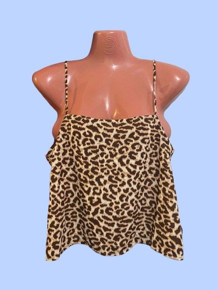 Leopard Print Cami Top (Category: Sleeveless) located in Manila. Submitted by joclutter (Listing ID 1467318708, Image 1). Description: - Brown and cream leopard print design - Thin spaghetti straps with a chic square neckline - Flowy, lightweight, and comfortable material - Versatile basic for layering or standalone wear - Pairs easily with denim jeans or shorts.