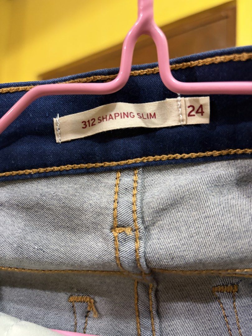 Levi's 312 Shaping Slim Jeans (Category: Jeans) located in Calamba. Submitted by handpickedbynetty (Listing ID 1467224217, Image 2). Description: - Brand/Model: Levi's 312 Shaping Slim Jeans - Wash: Dark wash denim - Size: 24 - Features: Classic five-pocket styling, contrast stitching, and back leather patch - Fit: Flattering, curve-hugging design.