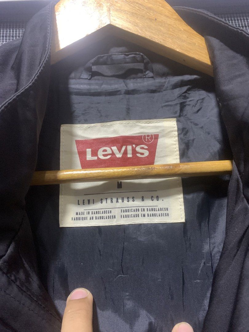 Levi's Black Bomber Jacket Size M (Category: Coats, Jackets and Outerwear) located in Antipolo. Submitted by RAREFINDS (Listing ID 1467328783, Image 3). Description: - Brand: Levi's - Style: Black bomber jacket - Size: Medium - Closure: Full zip front with high collar - Features: Utility pocket on the left sleeve, ribbed cuffs and hem - Material: 100% polyester (Made in Bangladesh) - Condition/Vibe: Classic everyday outerwear, super easy to match