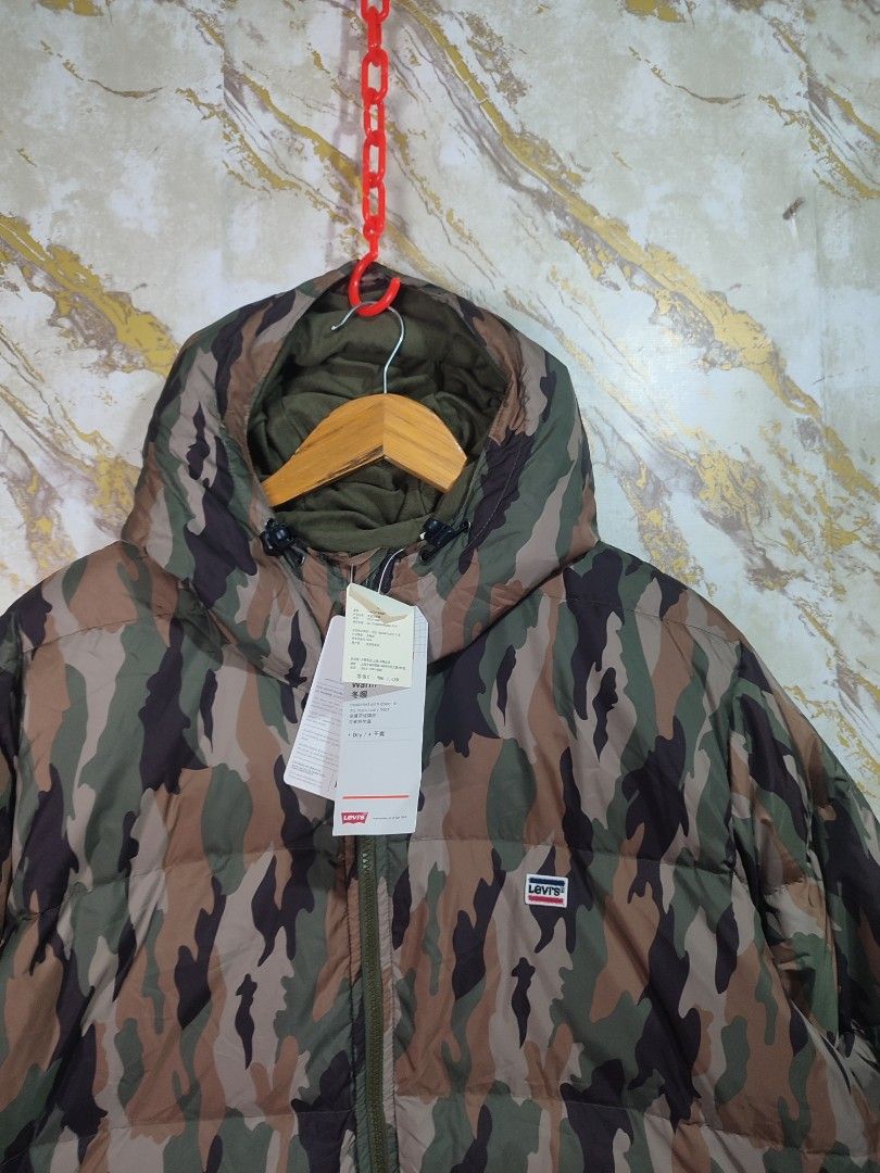 Levi's Camouflage Puffer Jacket Down Winter Coat (Category: Coats, Jackets and Outerwear) located in Cabuyao City. Submitted by jederama (Listing ID 1467272516, Image 3). Description: LEVIS PERFORMANCE PUFFER JACKET SIZE : LARGE ON TAG WIDTH - 25 LENGTH - 31 WATER REPELLENT BRAND NEW WITG TAG NO ISSUE / NO FLAWS AUTHENTIC 💯 1,900 + SHIPPING FEE.