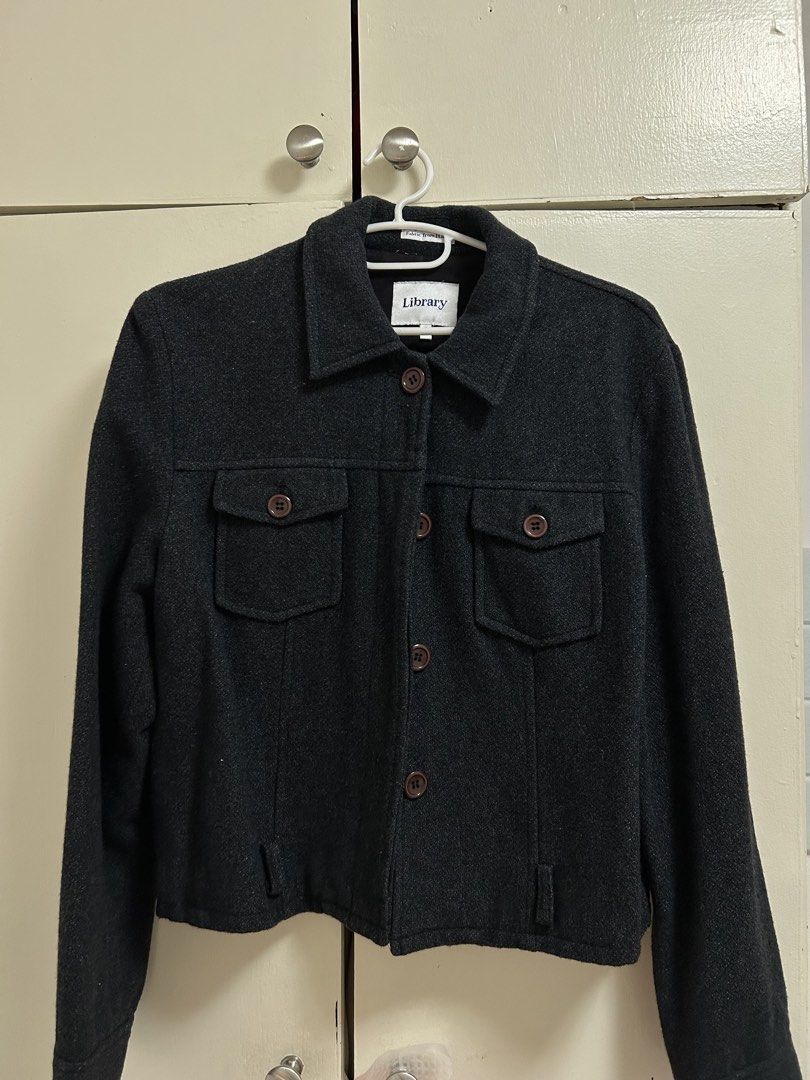 Library Dark Grey Wool Jacket Coat with Front Pockets (Category: Coats, Jackets and Outerwear) located in Pateros City. Submitted by safewind_85fc6d (Listing ID 1467323802, Image 1). Description: - Brand: Library - Color: Dark grey with brown buttons - Material: Premium wool (fabric sourced from Italy) - Features: Button-up front, standard collar, long sleeves, two chest flap pockets with button closures - Style: Clean structure, versatile outerw
