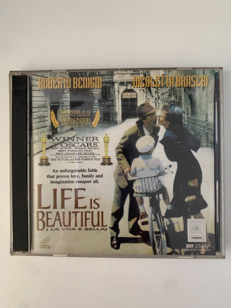 Life Is Beautiful La Vita E Bella VCD (Category: CDs & DVDs) located in Pasig City. Submitted by thesunshinestore (Listing ID 1467225337, Image 1). Description: - Title: Life Is Beautiful (VCD) - Cast: Roberto Benigni, Nicoletta Braschi - Format: Double disc in original plastic case with cover art and back inlay - Publisher: Viva Video (Copyright 2000) - Condition: Tested and works fine - Perfect for movie collectors and film enthusiasts.
