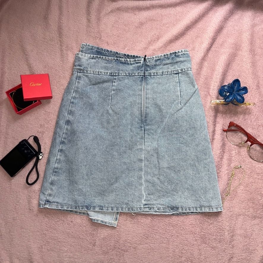 Light Asymmetrical Overlap A-Line Denim Skort (Category: Skirts) located in Angeles City. Submitted by ownit_ac (Listing ID 1467180363, Image 2). Description: Already laundered, ready to wear 3 buttons in front (all are designs) Front pocket is a design With inner shorts Back zipper High waist S on tag Brand: Qin Qin Waist: 25-26 in. Length: 17-18 in. Color may vary due to lighting.