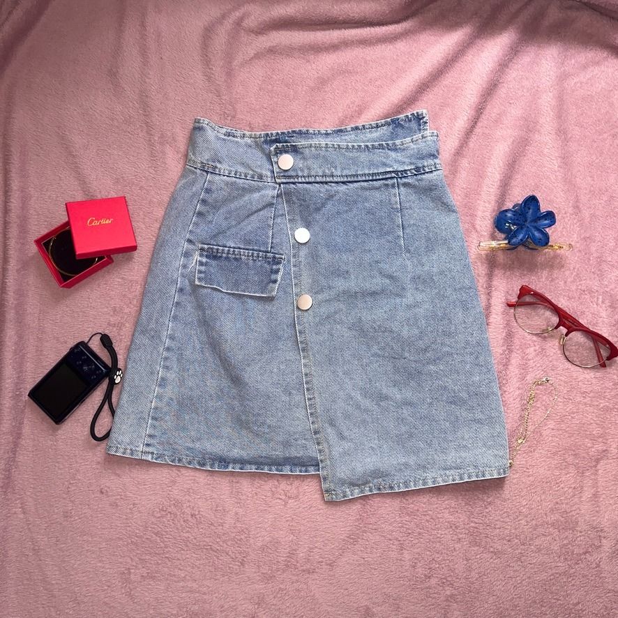 Light Asymmetrical Overlap A-Line Denim Skort (Category: Skirts) located in Angeles City. Submitted by ownit_ac (Listing ID 1467180363, Image 1). Description: Already laundered, ready to wear 3 buttons in front (all are designs) Front pocket is a design With inner shorts Back zipper High waist S on tag Brand: Qin Qin Waist: 25-26 in. Length: 17-18 in. Color may vary due to lighting.