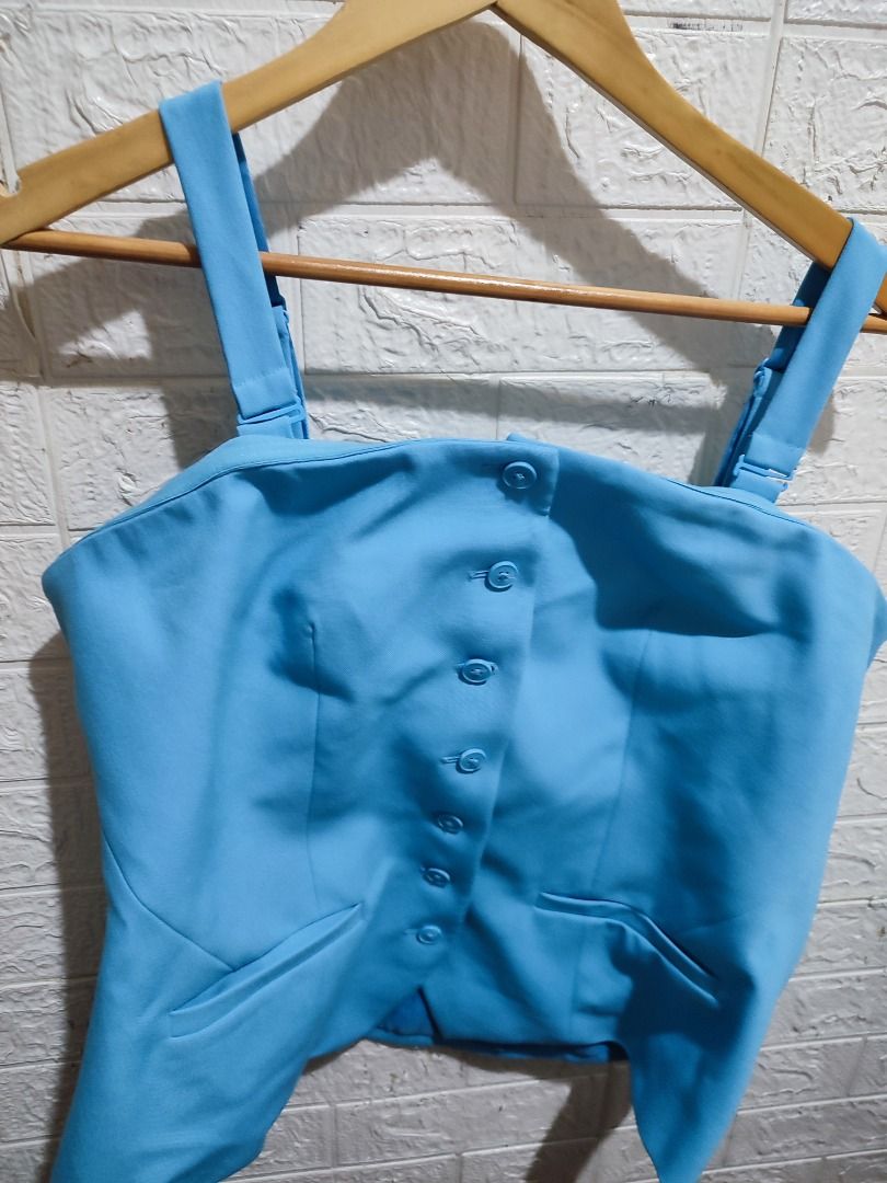 Light Blue Button-Front Vest Top with Straps size 16 & 18 available (Category: Sleeveless) located in Caloocan City. Submitted by jel_gielle (Listing ID 1467311804, Image 1). Description: - Color: Bright blue - Design: Thick shoulder straps, front button closure, and two slanted bottom pockets - Fit: Structured, great for solo wear or layering over tees - Condition: Clean fabric, no stains or damage noted.