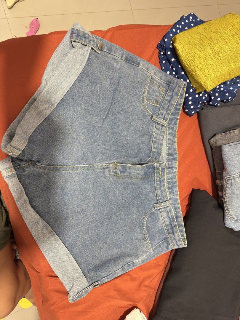 Light wash cuffed denim shorts with button tabs (Category: Shorts) located in Manila. Submitted by kimmy_yaaah (Listing ID 1467360250, Image 1). Description: plus size shorts - Style: Light wash denim shorts with highwaits 34-36 - Details: Rolled cuffs with button strap accents on the sides, contrast yellow stitching - Pockets: Functional front and back pockets - Fit: Comfortable staple piece for warm weather - Pairing: Easily matches with casual