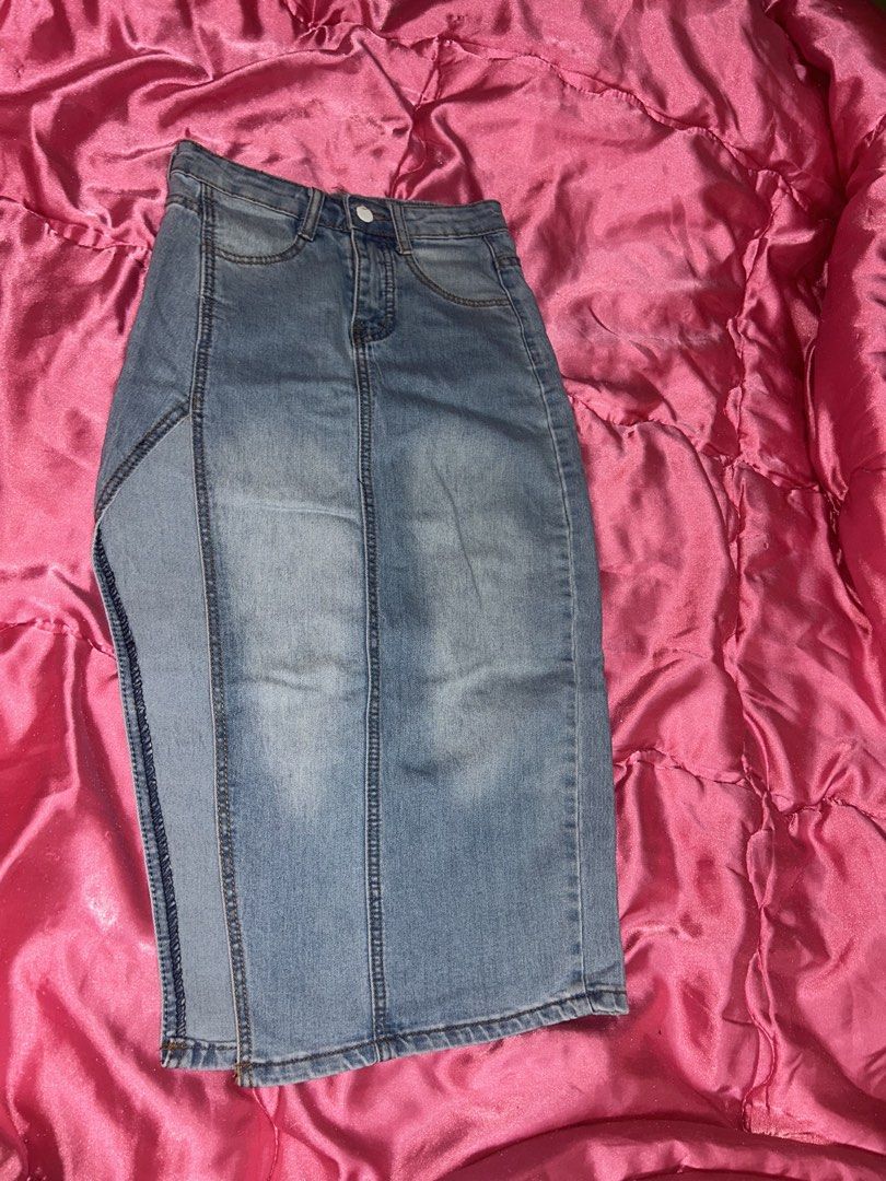 Light wash denim midi skirt with front split (Category: Skirts) located in Manila. Submitted by axlrose.17 (Listing ID 1467273583, Image 1). Description: - Style: Light wash denim midi skirt - Waist: High-waisted with belt loops, zip fly, and button closure - Details: Chic front slit on the left, vertical panel stitching, and back pockets - Fit: Comfortable and versatile for everyday wear - Condition: Brand new / Excellent (ready to ship!).