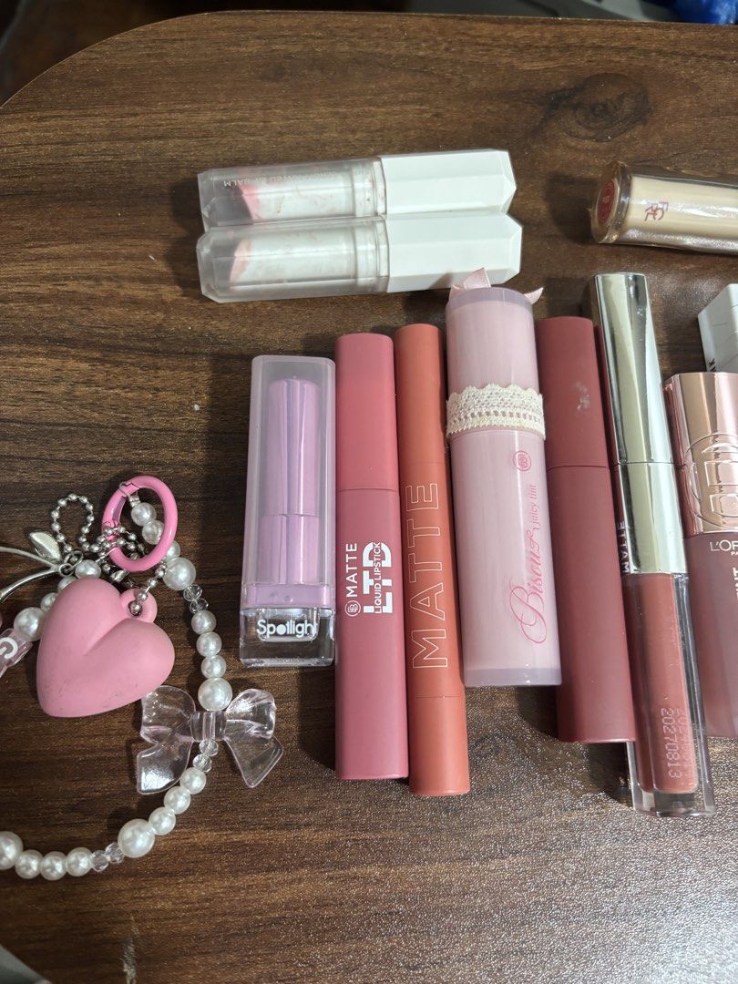 LIPSTICK BUNDLE (Category: Makeup) located in Makati City. Submitted by FashionFactory (Listing ID 1467349201, Image 2). Description: - Massive lip product bundle from top brands like Maybelline, L'Oreal, Happy Skin, and Bisous - Variety of shades including pinks, nudes, and berries - Mix of formulas: matte liquids, glossy tints, and hydrating balms - Bonus: Includes a cute charm bracelet - Great way to test multiple brands and formulas in one go