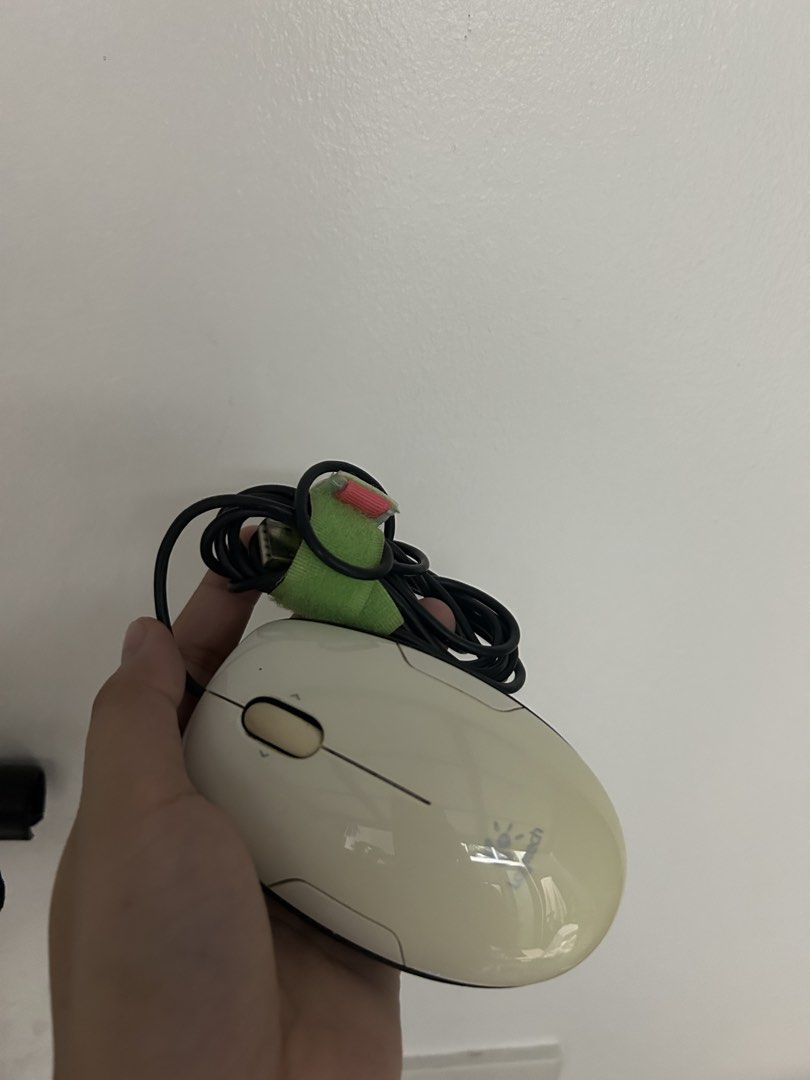 Logitech M-UAS144 Wired Laser Mouse (Category: Mouse & Mousepads) located in Cabiao. Submitted by ninaaaaaaahhh (Listing ID 1467312073, Image 1). Description: - Model: Logitech M-UAS144 wired mouse - Design: Stylish white top shell, black sides, and bright yellow base - Sensor: Equipped with a performance laser sensor - Connectivity: Wired USB with an attached green cable organizer strap - Condition: Pulled from storage, fully tested, and working