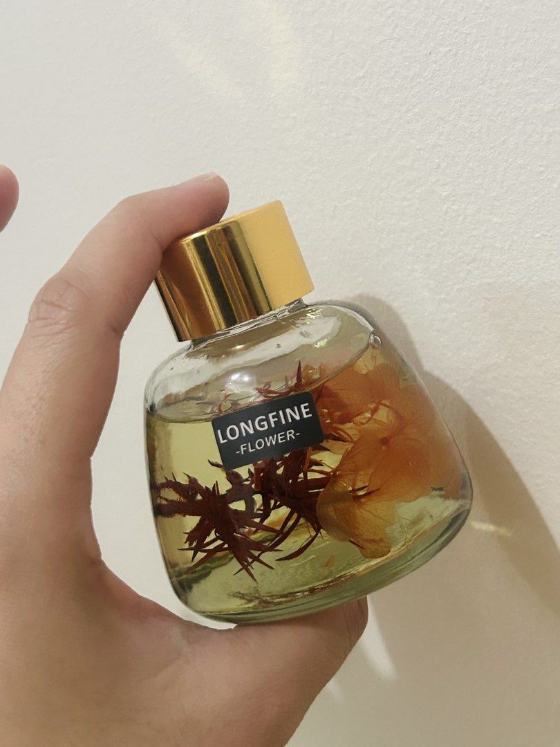Longfine Flower Reed Diffuser (Category: Home Fragrance) located in Quezon City. Submitted by fastocean.cf0f25 (Listing ID 1467361723, Image 2). Description: - Product: 4pcs Longfine Flower Reed Diffuser (opened one for pic only) - Features: Real preserved flowers sealed inside - Inclusions: Gold cap, black diffuser reeds, and white lid - Packaging: Brand new in unopened plain brown boxes - Use: Ideal for home fragrance, room decor, or gifts - bo