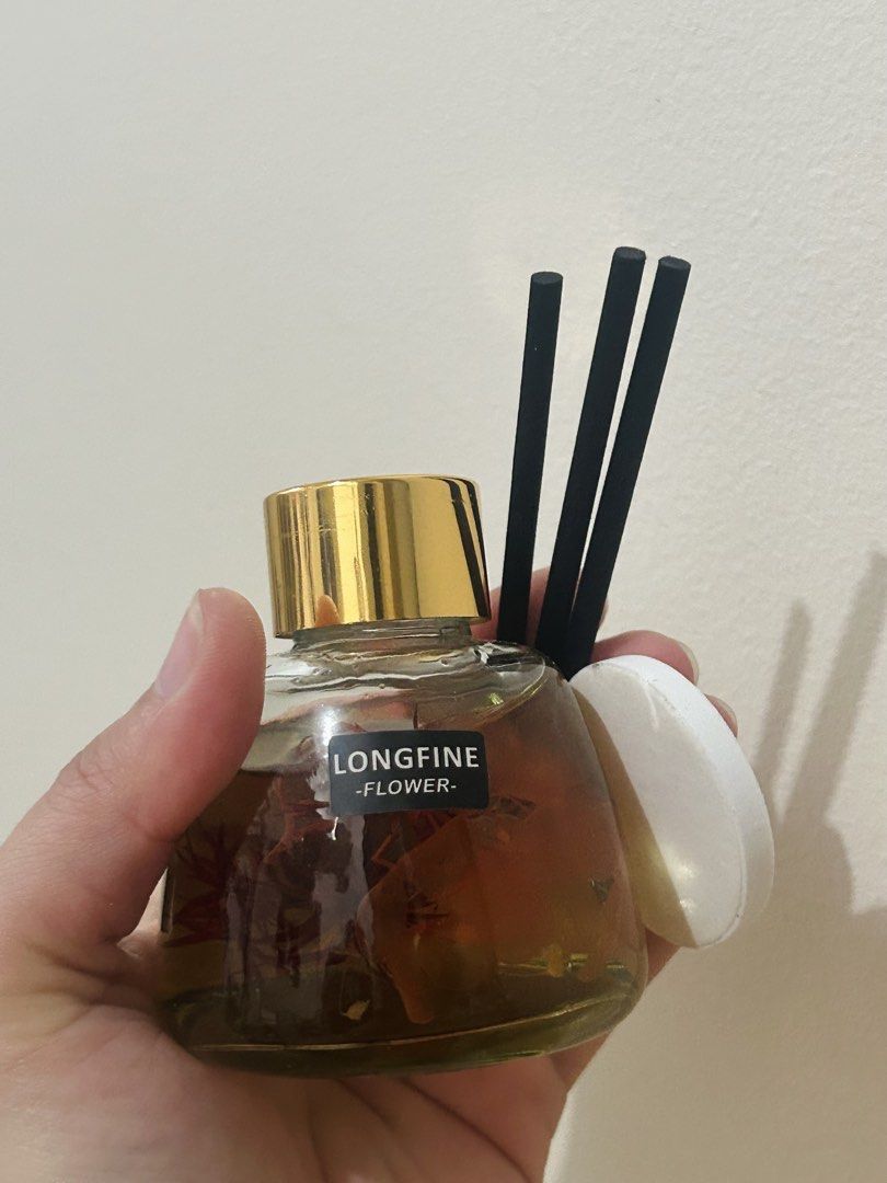 Longfine Flower Reed Diffuser (Category: Home Fragrance) located in Quezon City. Submitted by fastocean.cf0f25 (Listing ID 1467361723, Image 1). Description: - Product: 4pcs Longfine Flower Reed Diffuser (opened one for pic only) - Features: Real preserved flowers sealed inside - Inclusions: Gold cap, black diffuser reeds, and white lid - Packaging: Brand new in unopened plain brown boxes - Use: Ideal for home fragrance, room decor, or gifts - bo