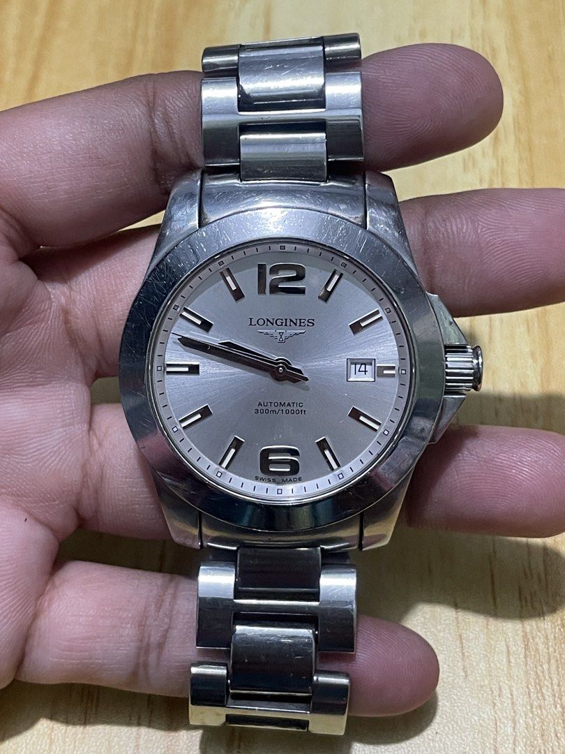 Longines Conquest (Category: Men's Watches) located in Taguig. Submitted by tester1x (Listing ID 1467281684, Image 2). Description: Longines Conquest Swiss Made L3. 658. 4 33983248 Automatic White Dial Sapphire Crystal All Stainless Steel Case & Bracelet 41mm 7inch wrist plus size Issue: Bracelet ( Lock, Loose ) .
