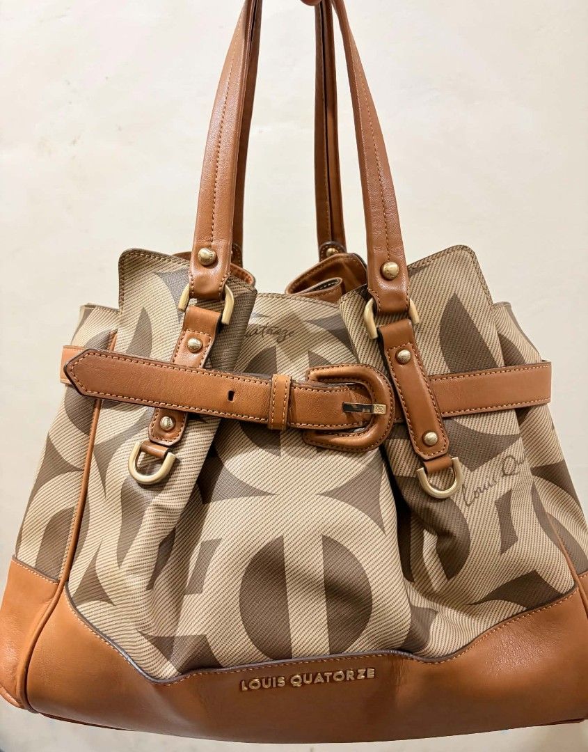 Louis Quatorze Monogram Tote Bag with Strap (Category: Luxury Bags & Wallets) located in Manila. Submitted by serenitycarlylle (Listing ID 1467349880, Image 1). Description: Official Louis Quatorze Monogram Canvas & Tan Leather Satchel Tote Elevate your everyday look with this elegant, high-end tote! ✨ Authentic Louis Quatorze 2-way satchel featuring the signature monogram jacquard print with rich tan genuine leather trim and gold-tone hardware. 