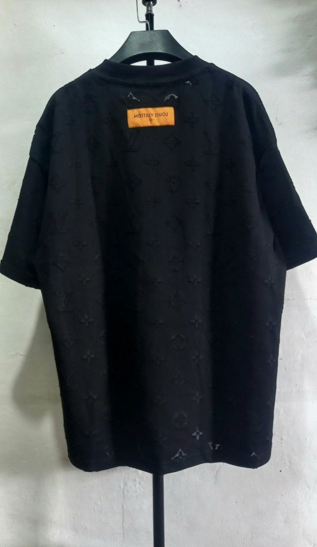 Louis Vuitton Monogram Black T-Shirt (Category: Tshirts & Polo Shirts ) located in Tarlac. Submitted by den420 (Listing ID 1467260148, Image 2). Description: - Brand: Louis Vuitton - Color: Black with all-over debossed monogram pattern - Fit: Relaxed fit, crew neck, short sleeves - Material: 100% Cotton, Made in Italy - Details: Signature branded blue neck tag and orange back tag label - Interior wash tag with care instructions and product code i