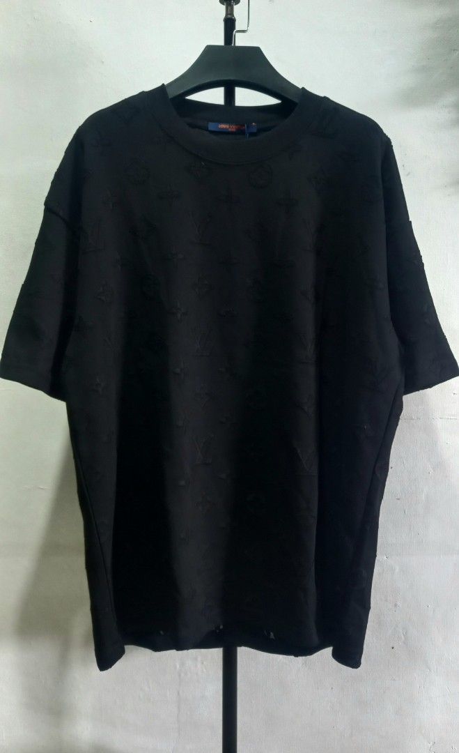 Louis Vuitton Monogram Black T-Shirt (Category: Tshirts & Polo Shirts ) located in Tarlac. Submitted by den420 (Listing ID 1467260148, Image 1). Description: - Brand: Louis Vuitton - Color: Black with all-over debossed monogram pattern - Fit: Relaxed fit, crew neck, short sleeves - Material: 100% Cotton, Made in Italy - Details: Signature branded blue neck tag and orange back tag label - Interior wash tag with care instructions and product code i