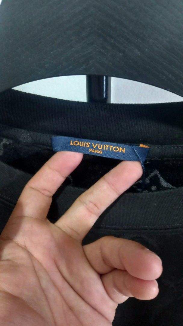 Louis Vuitton Monogram Black T-Shirt (Category: Tshirts & Polo Shirts ) located in Tarlac. Submitted by den420 (Listing ID 1467260148, Image 3). Description: - Brand: Louis Vuitton - Color: Black with all-over debossed monogram pattern - Fit: Relaxed fit, crew neck, short sleeves - Material: 100% Cotton, Made in Italy - Details: Signature branded blue neck tag and orange back tag label - Interior wash tag with care instructions and product code i