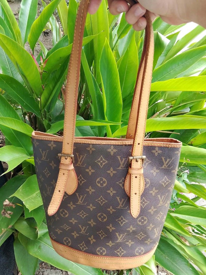 Louis Vuitton Monogram Bucket Bag (Category: Shoulder Bags) located in Midsayap. Submitted by purse_gedo (Listing ID 1466997780, Image 1). Description: - Louis Vuitton monogram canvas bucket bag - Classic brown LV print with durable tan leather trim - Adjustable double shoulder straps for a custom fit - Cream-colored leather interior lining with a secure zipper pocket - Shiny gold-tone hardware featuring LV logo zipper pull - Four protective meta