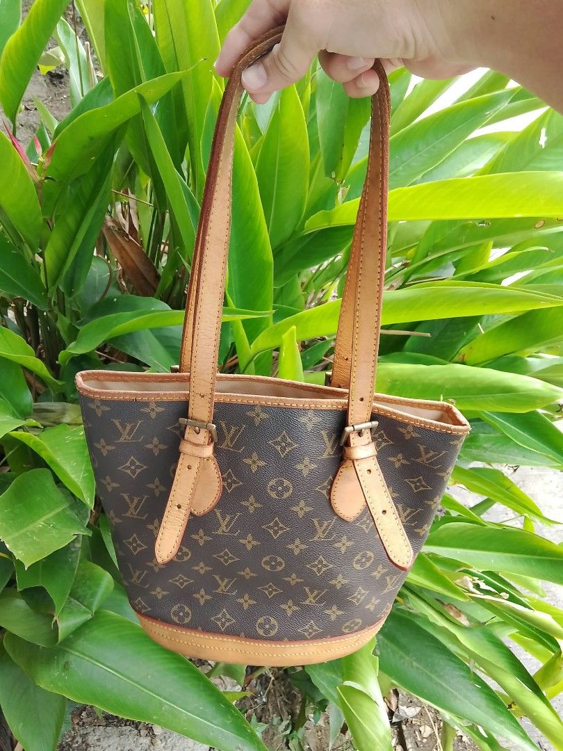 Louis Vuitton Monogram Bucket Bag (Category: Shoulder Bags) located in Midsayap. Submitted by purse_gedo (Listing ID 1466997780, Image 2). Description: - Louis Vuitton monogram canvas bucket bag - Classic brown LV print with durable tan leather trim - Adjustable double shoulder straps for a custom fit - Cream-colored leather interior lining with a secure zipper pocket - Shiny gold-tone hardware featuring LV logo zipper pull - Four protective meta