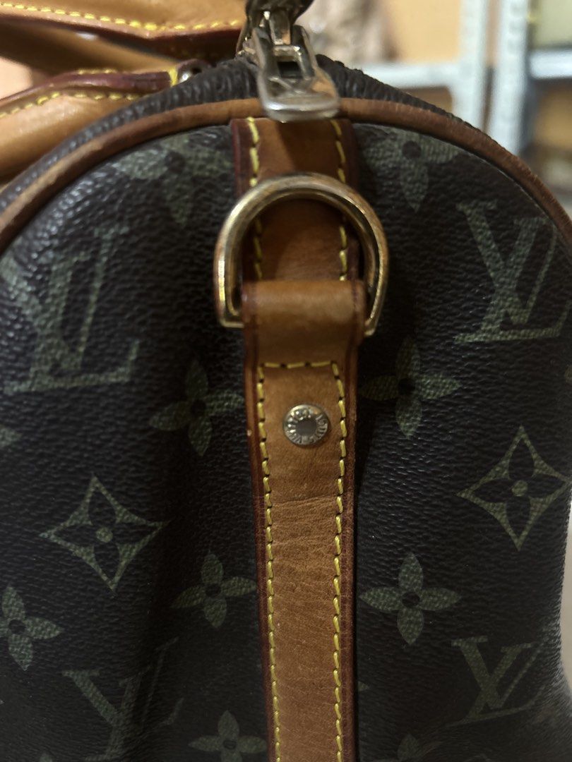 Louis Vuitton Monogram Canvas Speedy Bag (Category: Luxury Bags & Wallets) located in Valencia. Submitted by carmzfindsph (Listing ID 1467179520, Image 2). Description: Louis Vuitton Monogram canvas duffel bag. Classic brown print with tan leather handles and trim. Rolled leather top handles, brass zipper closure, and side D-rings attached to the leather strips. Iconic style with structured shape. 🤎 LV Monogram Handbag ✅ LV-engraved zipper pull 