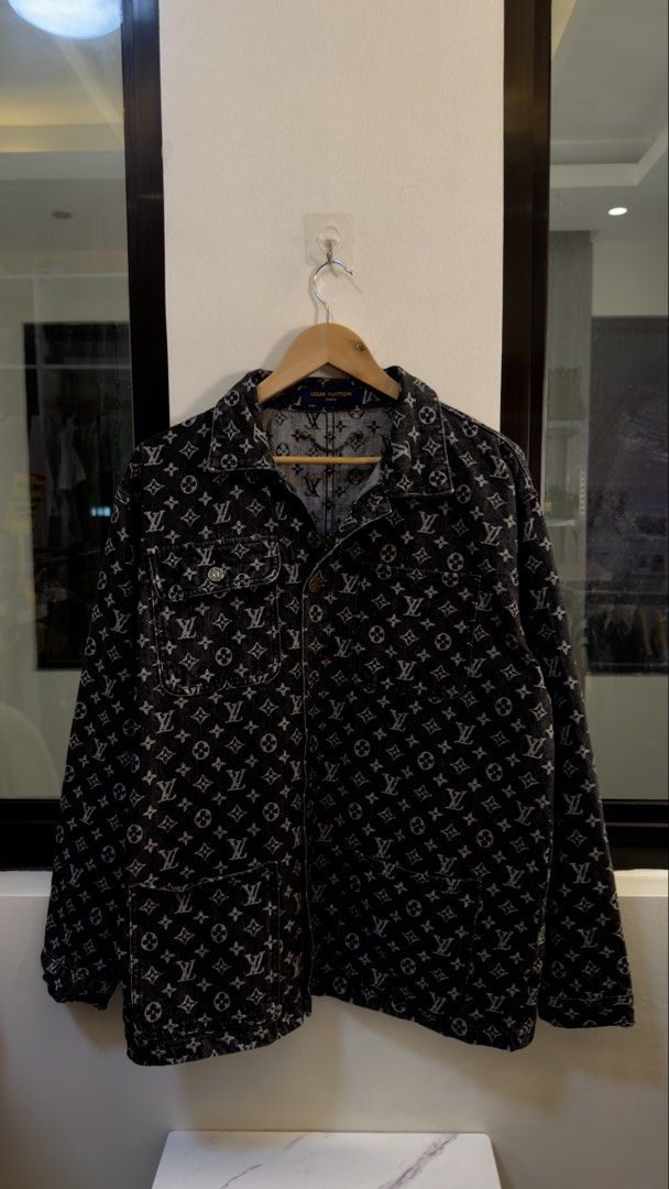Louis Vuitton Monogram Denim Jacket Size 52 (Category: Coats, Jackets and Outerwear) located in Paranaque City. Submitted by mykapoynton (Listing ID 1467239667, Image 2). Description: Louis Vuitton Monogram Denim Jacket Size 52 - Style: All-over monogram black denim jacket - Closure & Pockets: Front button closure, dual chest pockets, and lower flap pockets - Special Feature: Stylish metal chain detail attached inside the collar - Origin & Sizing