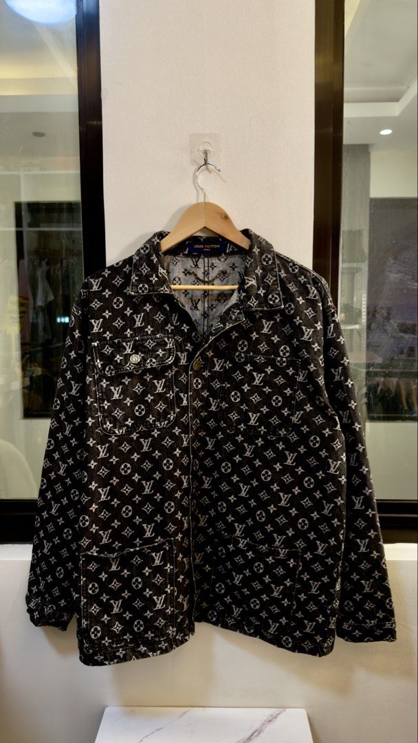 Louis Vuitton Monogram Denim Jacket Size 52 (Category: Coats, Jackets and Outerwear) located in Paranaque City. Submitted by preluxeshop_ph (Listing ID 1467295331, Image 2). Description: Louis Vuitton Monogram Denim Jacket Size 52 - Style: All-over monogram black denim jacket - Closure & Pockets: Front button closure, dual chest pockets, and lower flap pockets - Special Feature: Stylish metal chain detail attached inside the collar - Origin & Siz
