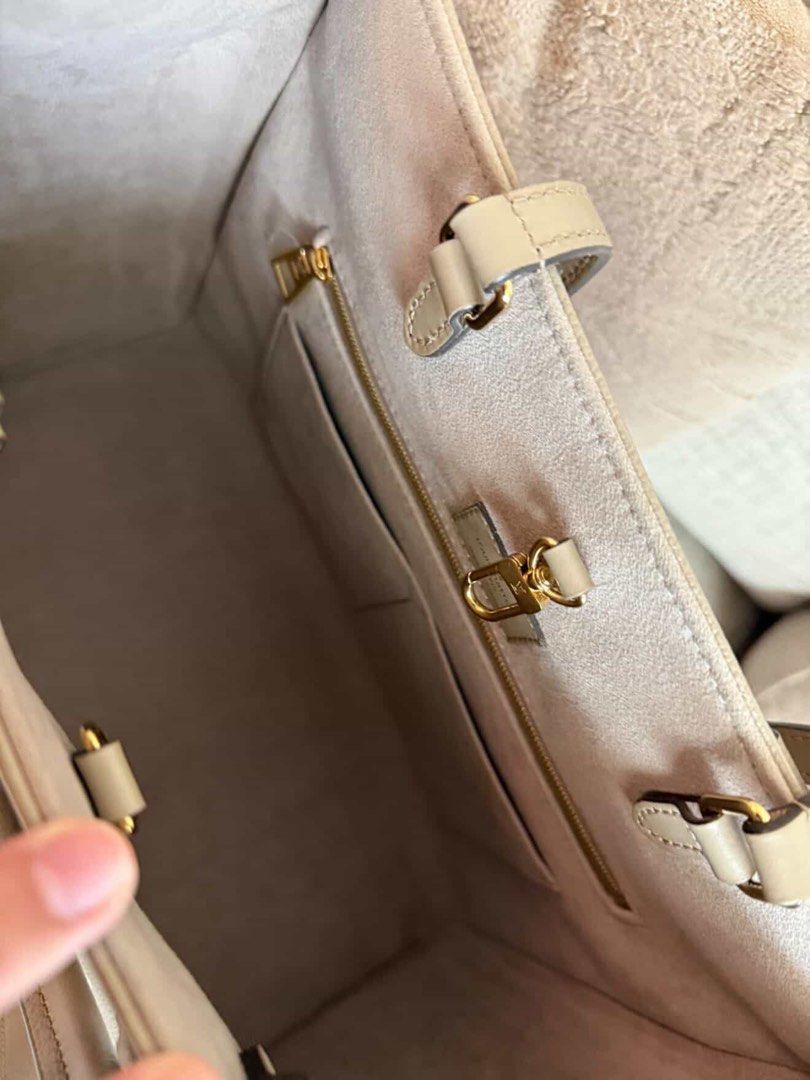 Louis Vuitton Monogram Empreinte Tote Bag Grey (Category: Luxury Bags & Wallets) located in Manila. Submitted by patrice29 (Listing ID 1467274200, Image 3). Description: - Authentic Louis Vuitton tote bag - Premium grey leather with off-white embossed monogram pattern - Spacious interior with clean suede-like lining - Convenient internal zip pocket and gold-tone hardware - Dual top handles for easy carry - Well-structured base and side panels tha