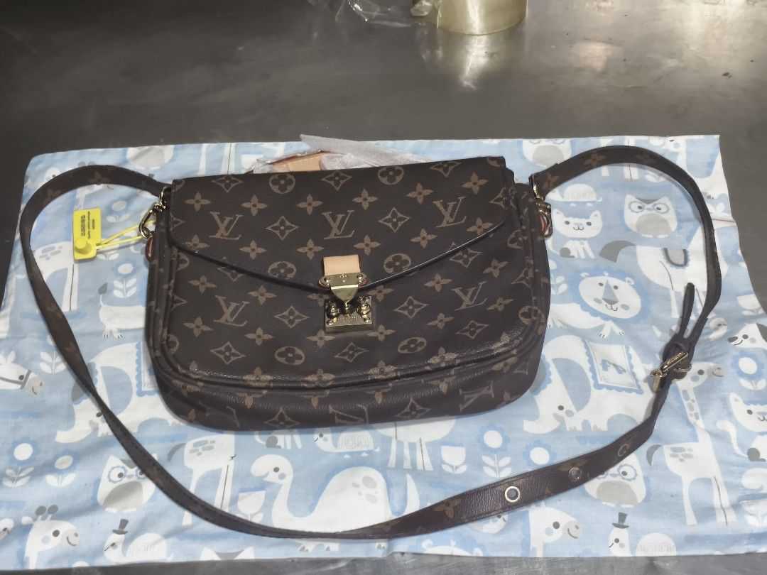 Louis Vuitton Monogram Messenger Crossbody Bag (Category: Luxury Bags & Wallets) located in Quezon City. Submitted by anitagalan89774 (Listing ID 1467177652, Image 1). Description: - Louis Vuitton monogram canvas crossbody bag - Elegant dark brown leather strap with adjustable buckle details - Secure gold-tone hardware front flap closure - Spacious interior with multiple compartments and fabric lining - Convenient exterior back zippered pocket - 