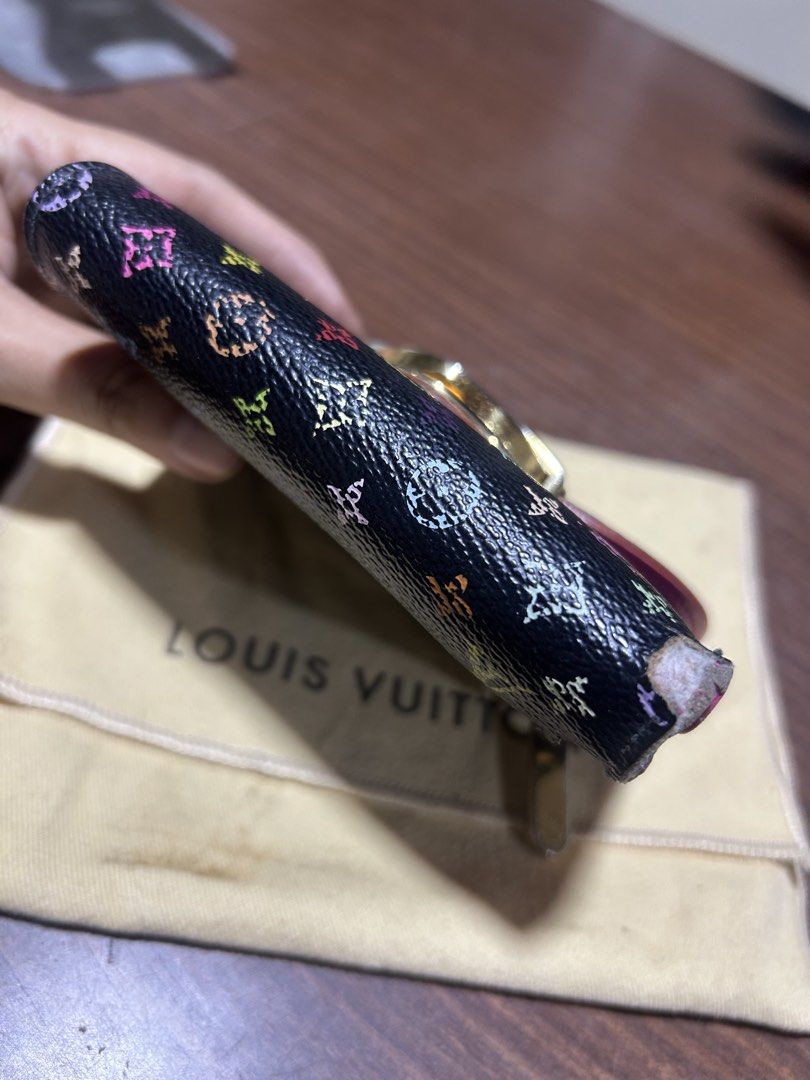 Louis Vuitton Monogram Multicolore Black Wallet (Category: Luxury Bags & Wallets) located in Manila. Submitted by starbalesukandjapansurplus (Listing ID 1467345023, Image 3). Description: - Authentic Louis Vuitton wallet - Iconic black Monogram Multicolore canvas - Vibrant pink leather interior lining - Secure gold-tone lock closure on the front flap - Includes original dust bag - Condition: As seen in photos.