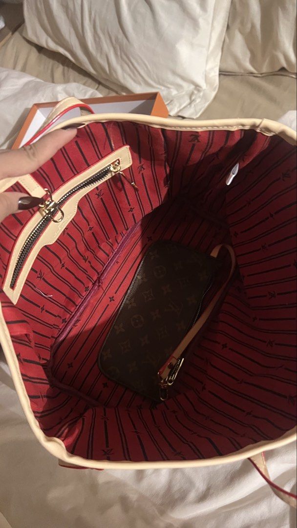 Louis Vuitton Monogram Neverfull Tote Bag NEVER USED (Category: Luxury Bags & Wallets) located in Manila. Submitted by dianavictoriano (Listing ID 1467327614, Image 3). Description: - Monogram canvas tote with premium cowhide leather trim - Elegant gold-tone hardware and classic red striped textile lining - Includes matching detachable zippered pouch - Structured base with side laces to easily adjust capacity - Dual comfortable shoulder straps - 