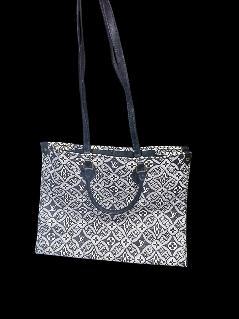 Louis Vuitton Monogram Tote Bag Black White (Category: Luxury Bags & Wallets) located in Quezon City. Submitted by anitagalan89774 (Listing ID 1467180255, Image 1). Description: - Material: Black and white monogram jacquard canvas with dark leather trim - Straps: Comfortable dark leather shoulder straps and matching top handles - Interior: Roomy fabric lining featuring a secure zip pocket and handy slip pockets - Hardware: Elegant gold-tone hardw