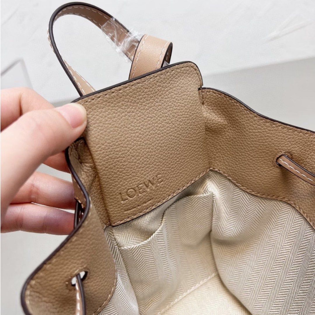Lo*we mini hammock bag (Category: Cross-body Bags) located in Davao. Submitted by closetbyjj (Listing ID 1467357845, Image 2). Description: New Light beige 15 cm H, 14 cm W, 10 cm D.