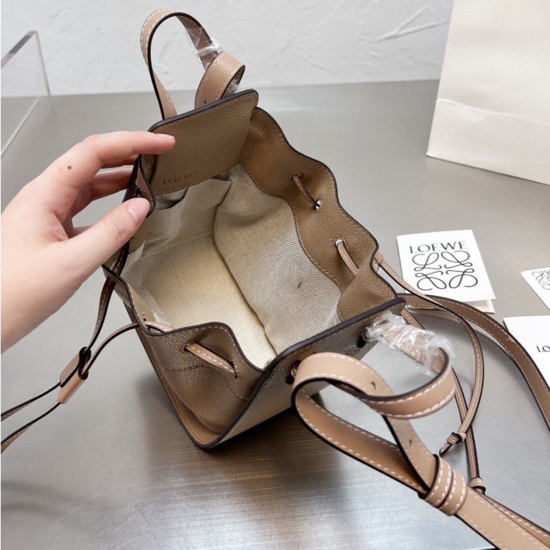 Lo*we mini hammock bag (Category: Cross-body Bags) located in Davao. Submitted by closetbyjj (Listing ID 1467357845, Image 3). Description: New Light beige 15 cm H, 14 cm W, 10 cm D.