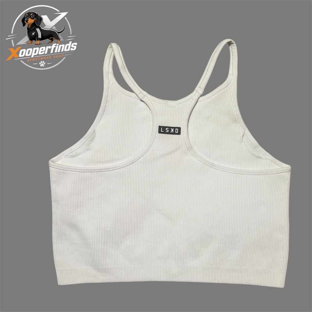 Lskd minimal seamless ribbed tank large (Category: Activewear) located in Iba. Submitted by xooperfindslb (Listing ID 1467345663, Image 2). Description: LSKD minimal seamless ribbed tabk top White Large on tag Can pass as new No issue Chest width when laid flat - 14”.