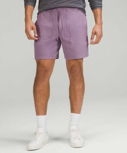 Lululemon 'At Ease Short 7' (Category: Shorts) located in Aroroy. Submitted by dr0p-a-dr1p (Listing ID 1467276673, Image 2). Description: Waist: 32-36 Length: 18 Hem: 13 - Brand: Lululemon - Color: Purple Ash - Material: Unique waffle-like textured fabric - Waistband: Elastic with adjustable drawstring - Pockets: Convenient side hand pockets - Details: Iconic Lululemon logo near the hem - Condition: Great overall condition.