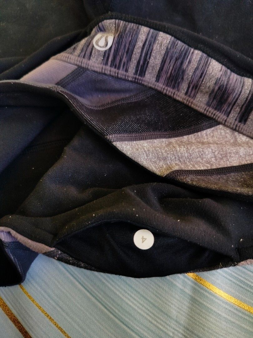 Lululemon Athletic Shorts Size 4 (Category: Shorts) located in Manila. Submitted by virgiliosa38485 (Listing ID 1467291594, Image 3). Description: Black athletic shorts from Lululemon with a wide patterned waistband in grey and black diagonal stripes. Size 4 tag printed inside the waistband pocket. Classic Lulu logo on the back. Stretchy fabric, great for workouts or running errands. Well-maintained piece with minimal wear..