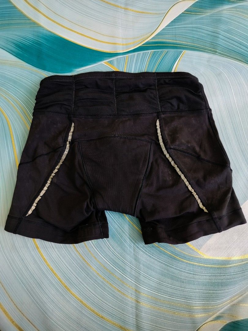 Lululemon Black Athletic Cycling Shorts Size 4 (Category: Activewear) located in Manila. Submitted by virgiliosa38485 (Listing ID 1467292642, Image 1). Description: - Brand: Lululemon - Size: 4 - Color: Black with neon yellow trim - Features: Padded seat insert for cycling comfort - Details: Classic reflective logo on hem, elastic waistband with back ruching - Condition: Excellent.