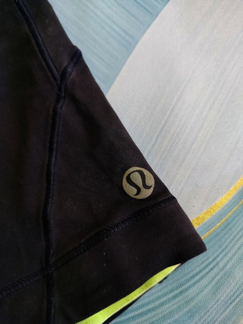 Lululemon Black Athletic Cycling Shorts Size 4 (Category: Activewear) located in Manila. Submitted by virgiliosa38485 (Listing ID 1467292642, Image 2). Description: - Brand: Lululemon - Size: 4 - Color: Black with neon yellow trim - Features: Padded seat insert for cycling comfort - Details: Classic reflective logo on hem, elastic waistband with back ruching - Condition: Excellent.