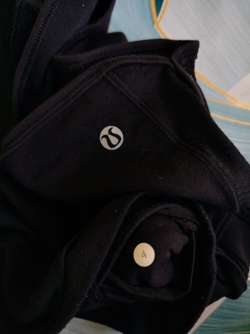 Lululemon Black Athletic Shorts Size 4 (Category: Shorts) located in Manila. Submitted by virgiliosa38485 (Listing ID 1467291741, Image 3). Description: - Brand: Lululemon - Size: 4 (verified via interior size dot) - Color: Classic Black - Design: Trendy crossover waistband with signature silver omega logos - Material: Comfortable, high-stretch athletic fabric.