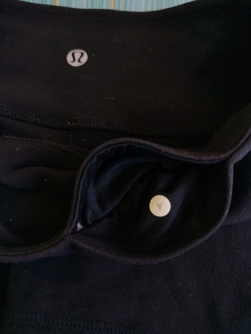 Lululemon Black Athletic Shorts Size 4 (Category: Shorts) located in Manila. Submitted by virgiliosa38485 (Listing ID 1467292315, Image 2). Description: - Brand: Lululemon - Style: Athletic shorts with high-rise waistband - Color: Solid black - Size: 4 (dot tag verified) - Details: Signature silver omega logo on lower left hem - Condition: Clean and ready to wear - Versatile for gym, running, or casual days.