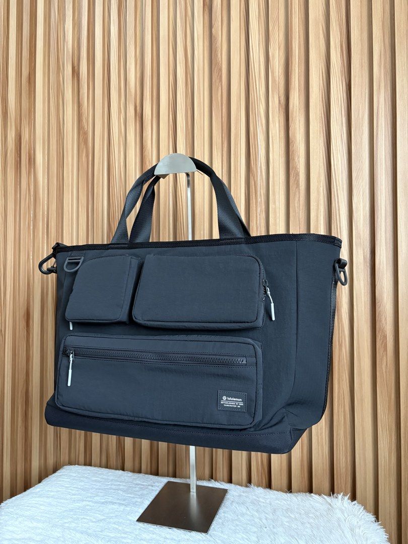 LULULEMON MULTI-POCKET TOTE BAG 19.5L (Category: Tote Bags) located in Imus. Submitted by dumpitlikeaqueen (Listing ID 1467233286, Image 3). Description: • Bag only; detachable pouch included • Open for layaway • Instagram Shop: @dumpitlikeaqueen.